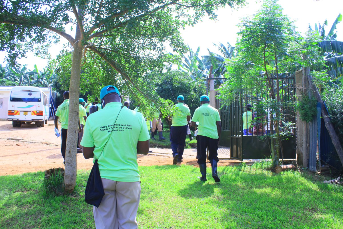 Green World Uganda team on a farm visit wearing Nutriplant-branded shirts